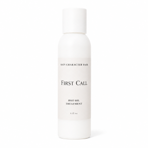 First Call Hot Oil Treatment by Hair for Heirs in an opaque white bottle.